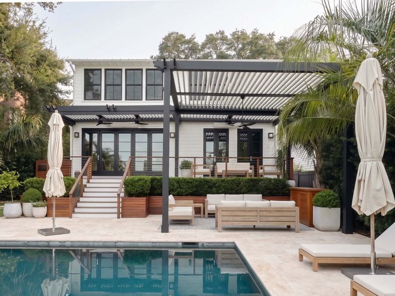 Southern California patio with a wood pergola casting shade over an outdoor dining space